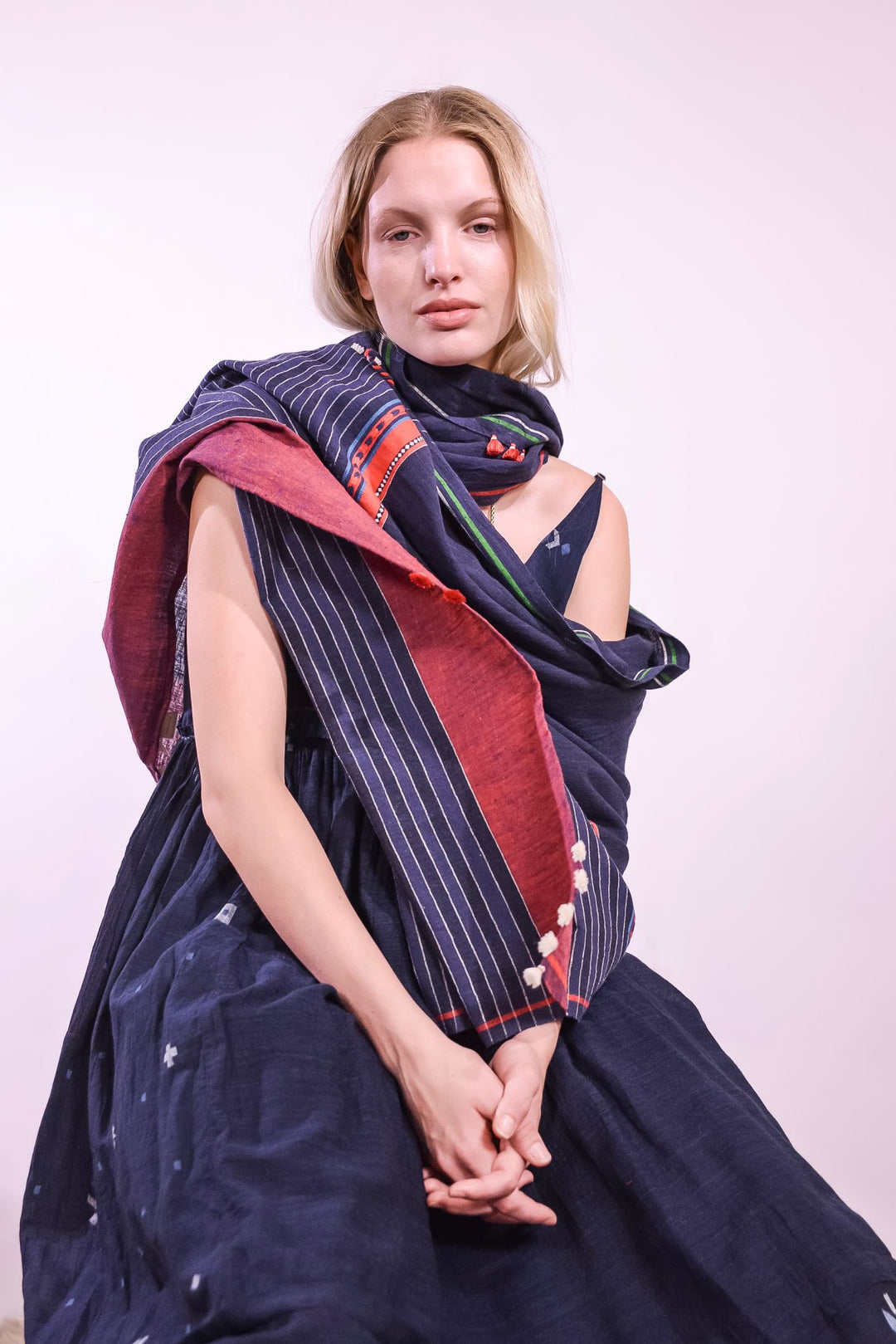 Detail of the magenta ruffle and cobalt stripe beneath the fitted bodice of the indigo Amber 73 Slip Dress by Injiri, curated by House of Nomad Stories.
