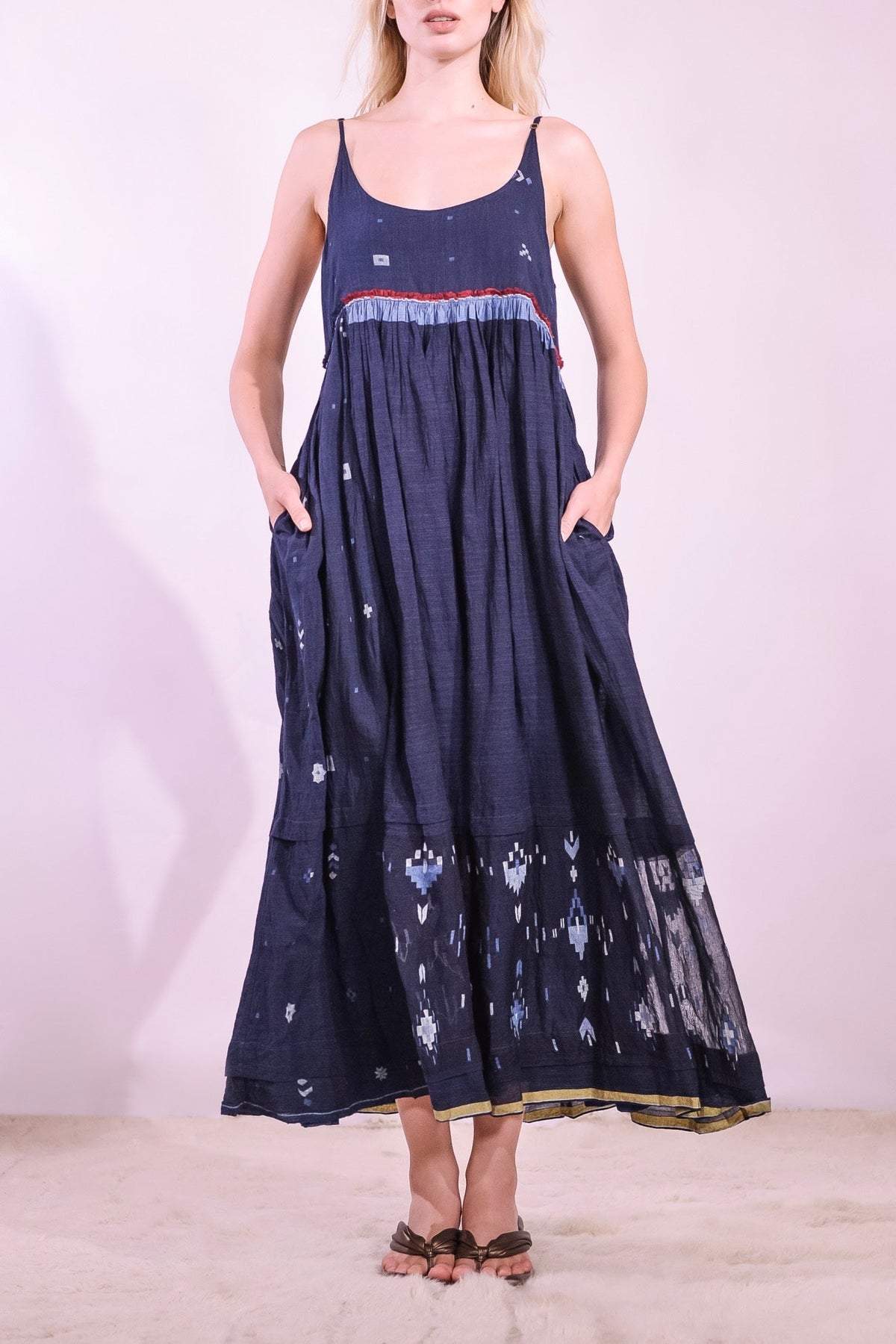 Model wearing the Amber 73 Slip Dress by Injiri, handmade in India from handwoven organic cotton naturally dyed in deep indigo, curated by House of Nomad Stories.