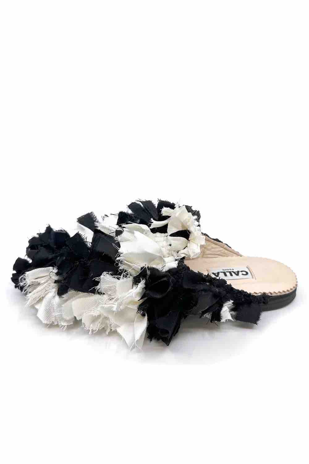 Limited edition Aili Babouche by CALLA from House of Nomad Stories, handmade from a unique vintage Berber rug with natural variations in texture, colour and detail that make every pair one of a kind.