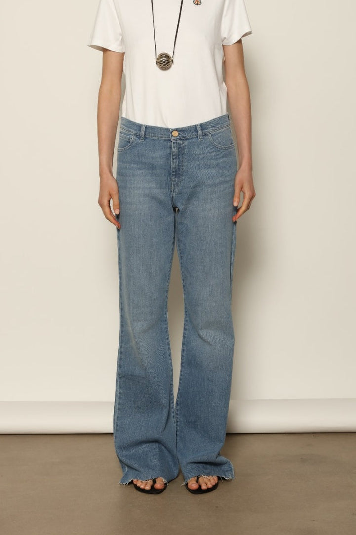 Le Cotton Pantalon Tulipe in 10 Years Blue by HAPPY HAUS, crafted from recycled Italian cotton denim with a mid to high waist and softly flared leg.