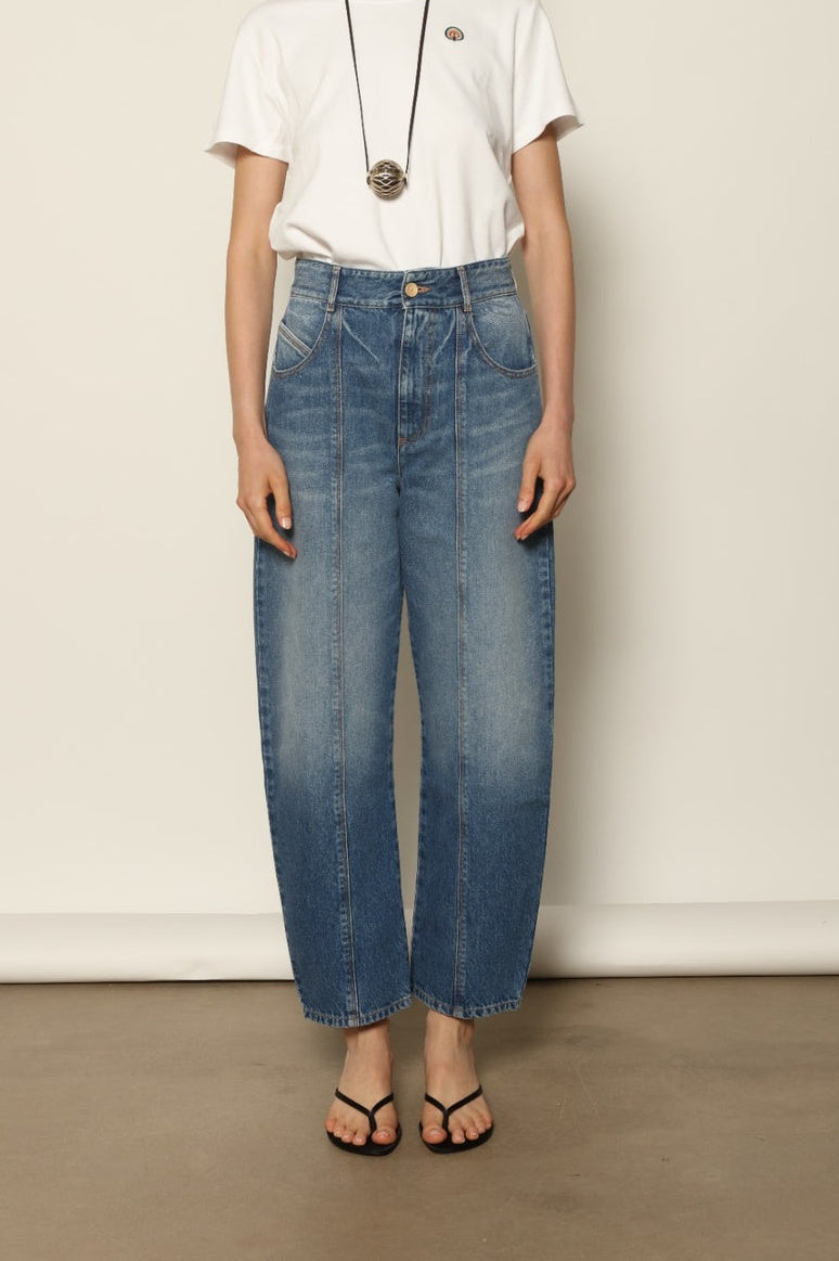 Le Pantalon Fleur in Blue d’Été by HAPPY HAUS, crafted from soft recycled denim with a high waist, straight leg and flower shaped back pockets.
