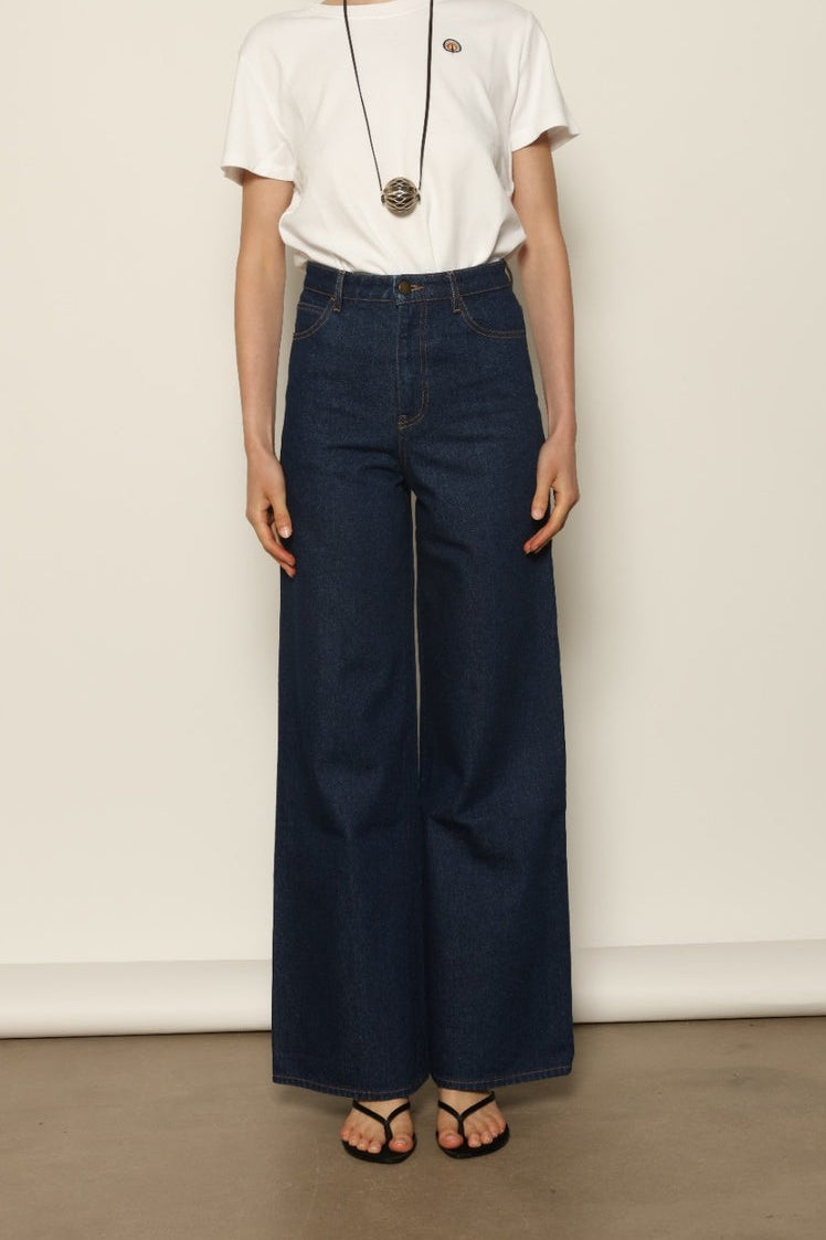 Le Pantalon Peacock by HAPPY HAUS, featuring a high waist, wide straight leg and vintage washed cotton.