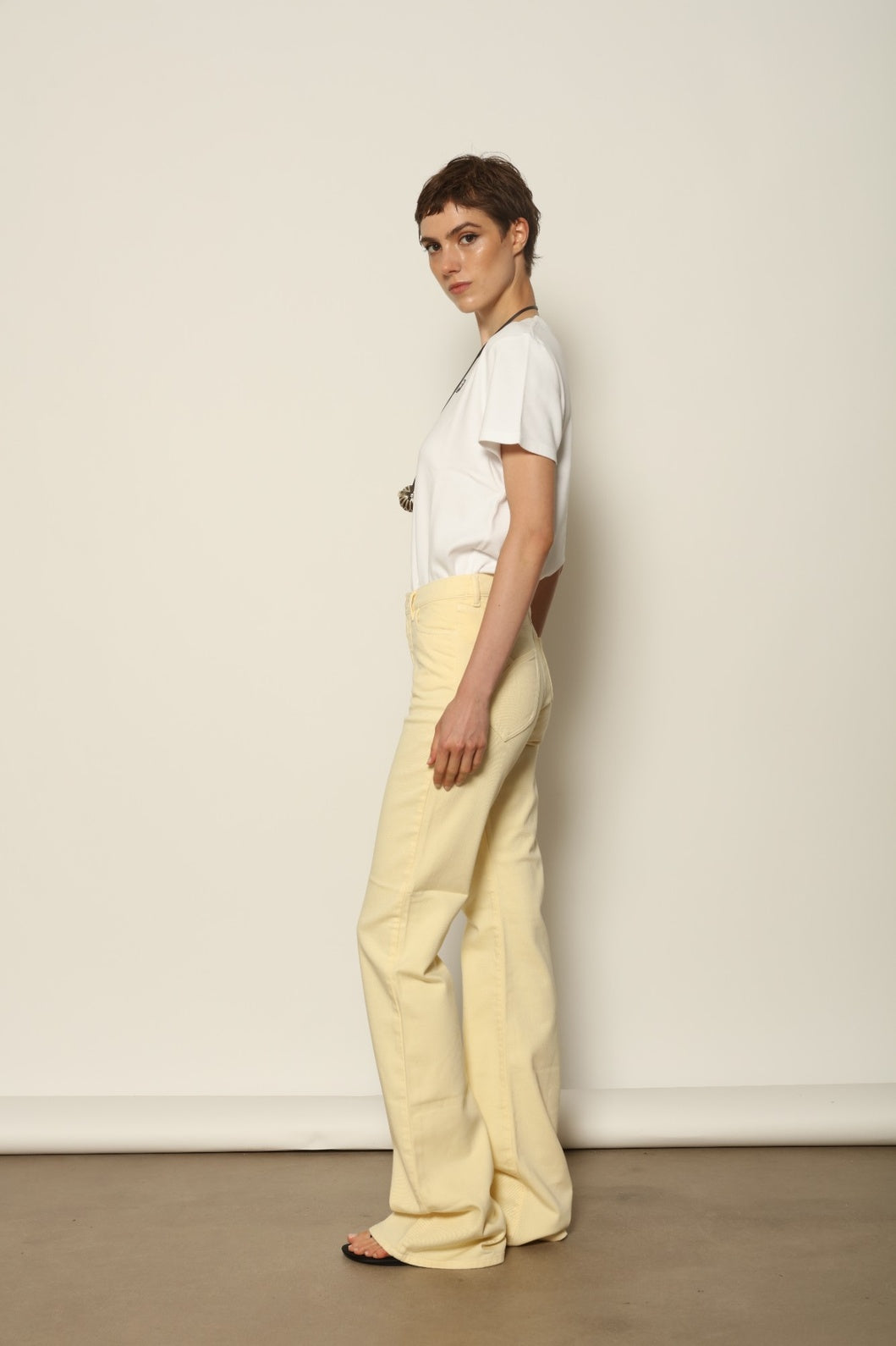 Drawstring detail on Le Pantalon Tulipe in Banana by HAPPY HAUS, allowing the trousers to be worn high or low waisted.