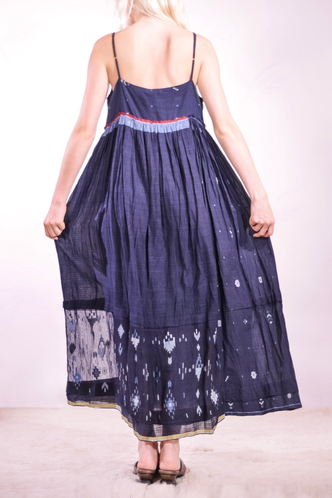 Back view of the Amber 73 Slip Dress by Injiri, handmade from naturally dyed indigo organic cotton with a light summer silhouette, curated by House of Nomad Stories.