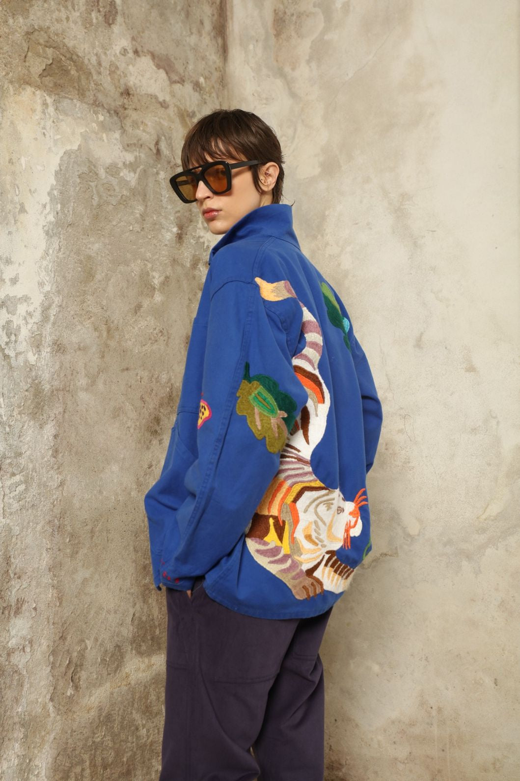 Hand embroidered bird and floral detail on the Kilometre Paris Bleu de Travail Jacket