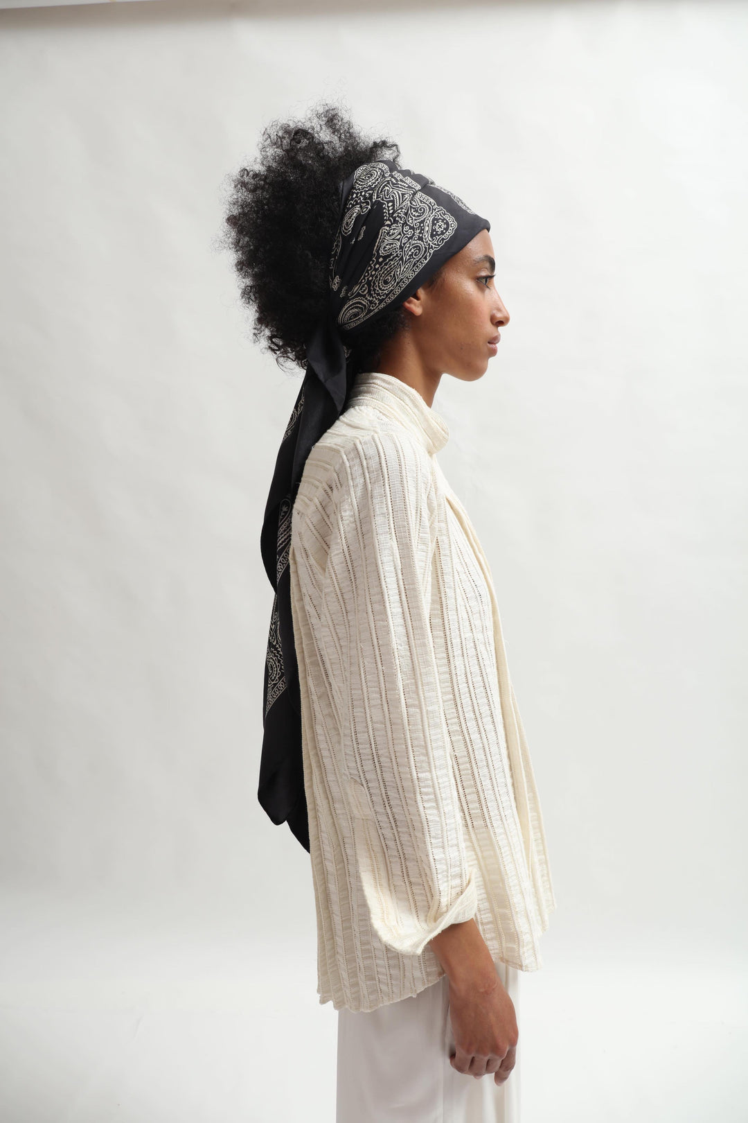 Leno Pleated Shirt by Paiwand made from upcycled cotton with breathable leno weave, featuring elegant pleats and handcrafted in India. Sustainable fashion curated by House of Nomad Stories.