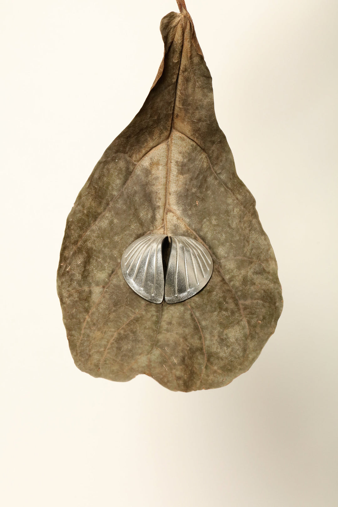 Loto Silver Leather Earrings by SO-LE STUDIO, selected by House of Nomad Stories, featuring layered petal-like forms that evoke a lotus flower opening in motion.