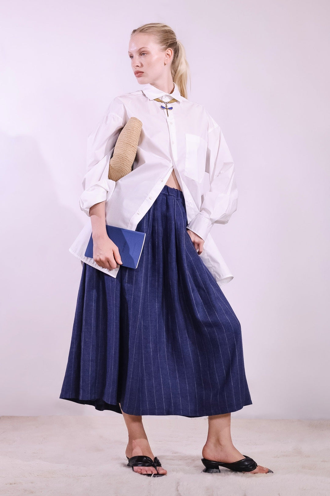 Refined Oscar Shirt made from 100% organic cotton with a crisp paper-touch finish, featuring minimalist design, clean lines, and classic collar. Handmade by House of Nomad Stories in Italy’s Piedmont region, combining sustainable luxury, fine tailoring, and timeless style.