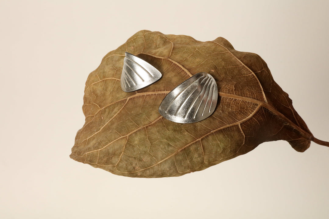 Loto Silver Statement Earrings by SO-LE STUDIO, part of the House of Nomad Stories curation, with a metallic finish that reflects light softly while remaining lightweight and comfortable.