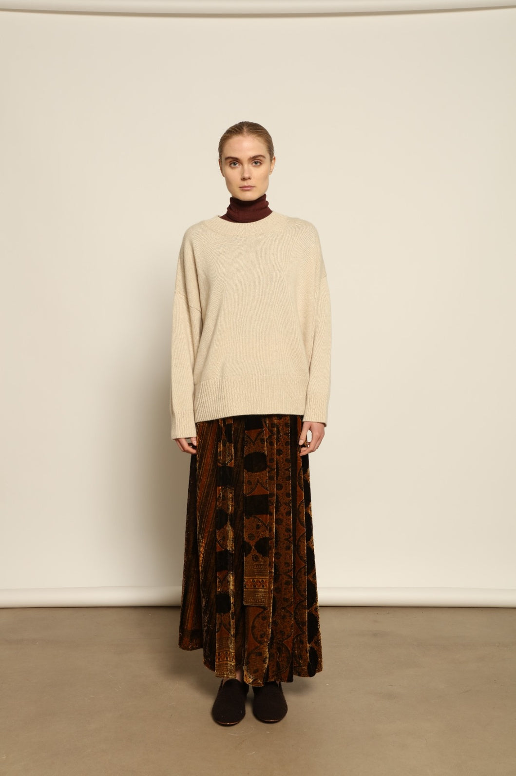 Model is wearing the Ambra Mauri Skirt by Obidi, made from premium flowing fabric with a flattering silhouette, combining contemporary design with traditional craftsmanship.