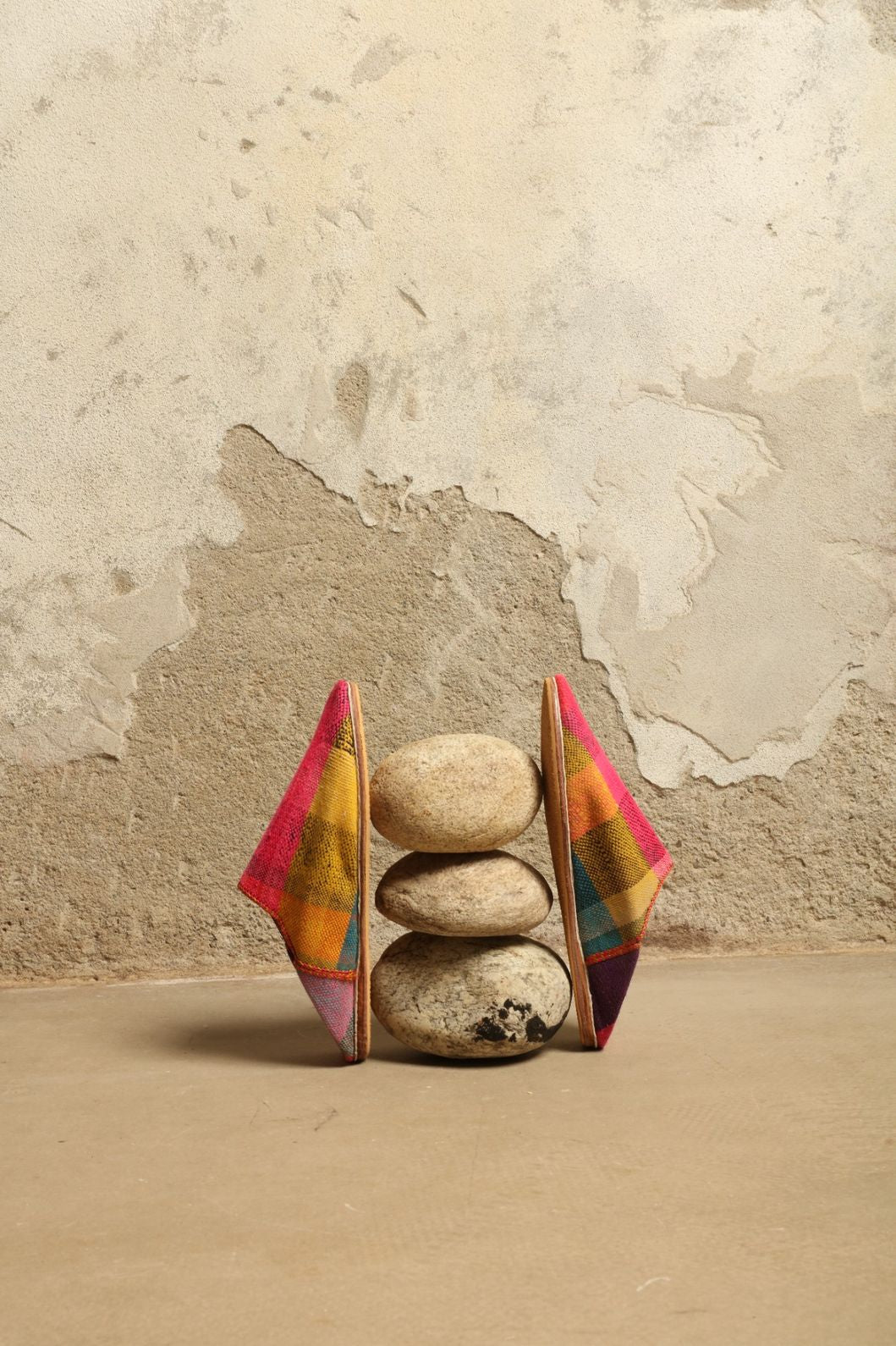 Model is wearing the Baboush in Kelim Fabric by House of Nomad Stories, handmade in Marrakesh with colorful handwoven kilim textile and ethically sourced leather sole, showcasing authentic Moroccan craftsmanship.
