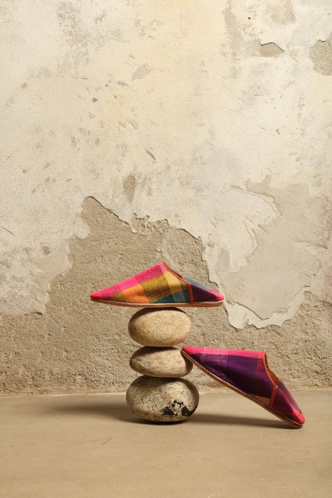 Model is wearing the Baboush in Kelim Fabric by House of Nomad Stories, handmade in Marrakesh with colorful handwoven kilim textile and ethically sourced leather sole, showcasing authentic Moroccan craftsmanship.