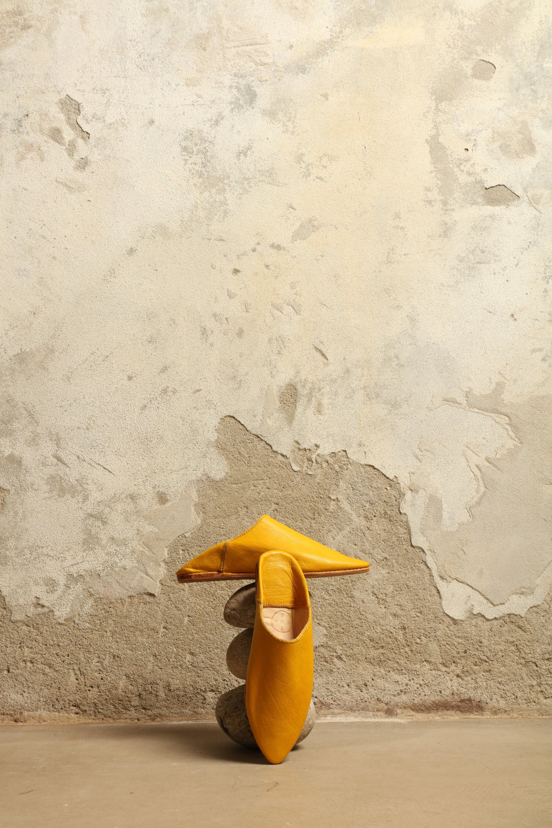 Model is wearing the Baboush in Yellow Leather by House of Nomad Stories, handcrafted in Marrakesh from ethically sourced leather with a warm yellow hue, cushioned sole, and timeless Moroccan design.