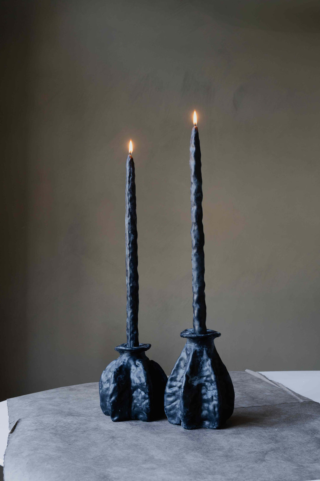 Carambola High in Black by Oberflacht, handcrafted beeswax candle holder with matching twig candle and sculptural matte finish.