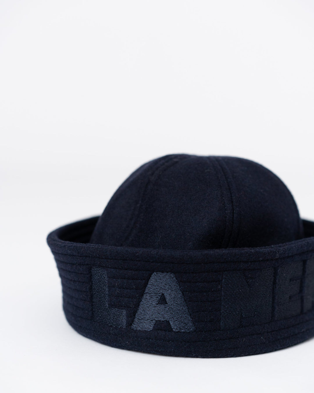 Model is wearing the Chapeau “LA MER” by Les Vacances d’Irina, a handmade cashmere and wool hat lined with Italian viscose and trimmed with a silk ribbon.