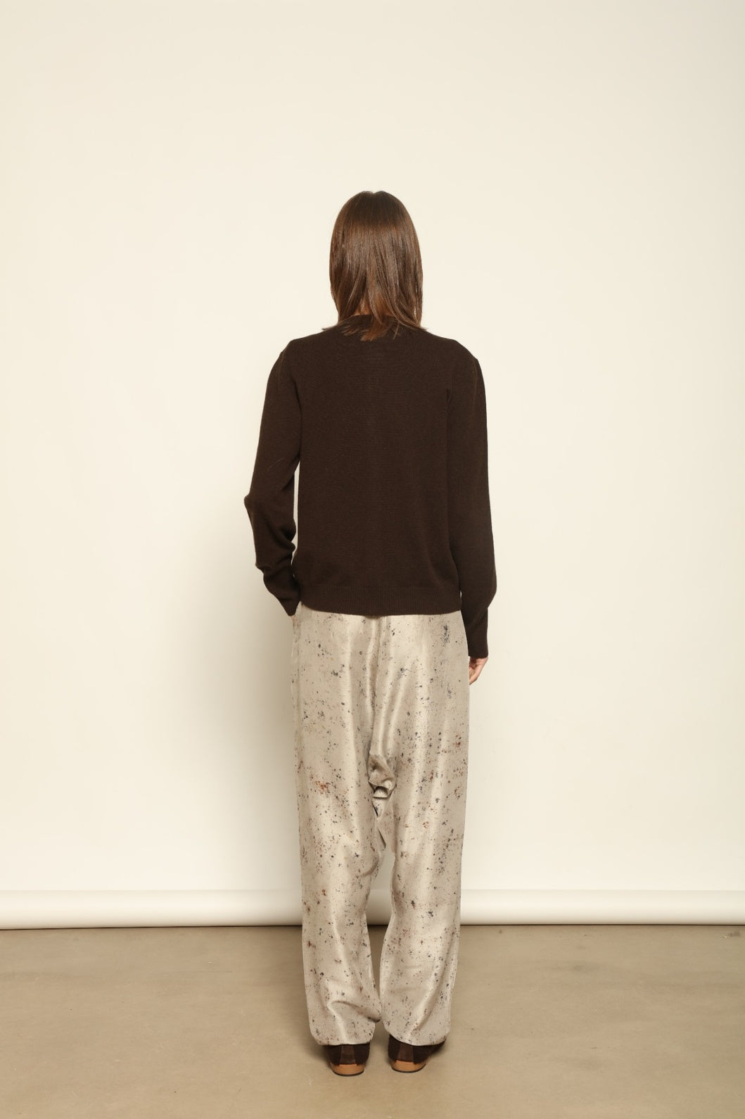 Model wearing the Chocolate Nathalie Open-Front Cashmere Cardigan by House of Nomad Stories, crafted from 100% Inner Mongolia cashmere, featuring a relaxed silhouette, smooth texture, and sustainable luxury knitwear in rich chocolate tone