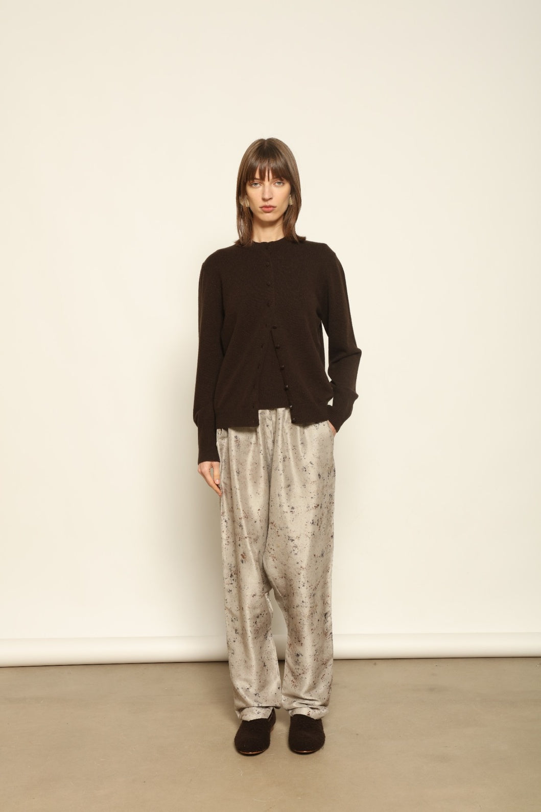 Model wearing the Chocolate Nathalie Open-Front Cashmere Cardigan by House of Nomad Stories, crafted from 100% Inner Mongolia cashmere, featuring a relaxed silhouette, smooth texture, and sustainable luxury knitwear in rich chocolate tone