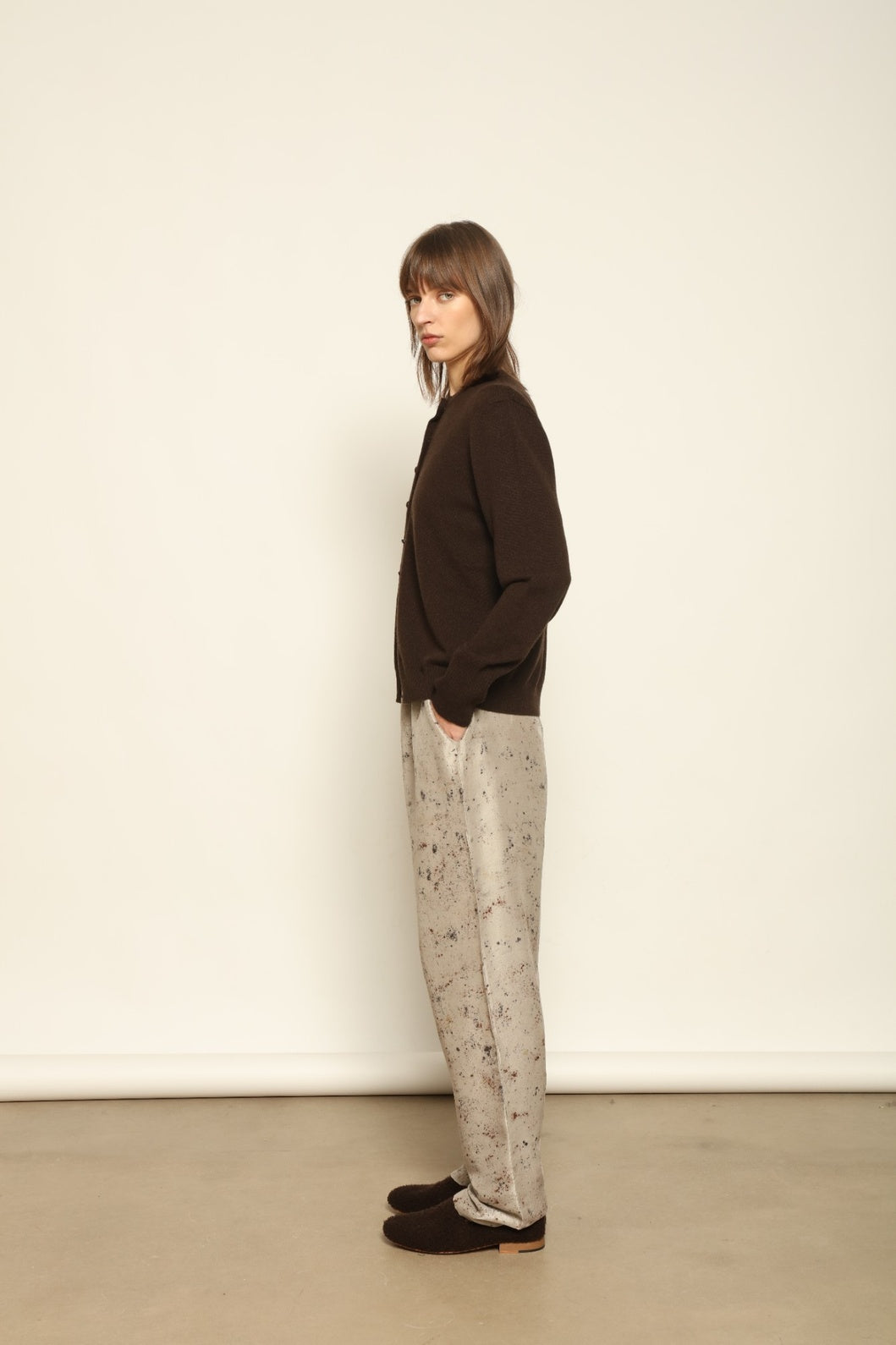 Model wearing the Chocolate Nathalie Open-Front Cashmere Cardigan by House of Nomad Stories, crafted from 100% Inner Mongolia cashmere, featuring a relaxed silhouette, smooth texture, and sustainable luxury knitwear in rich chocolate tone
