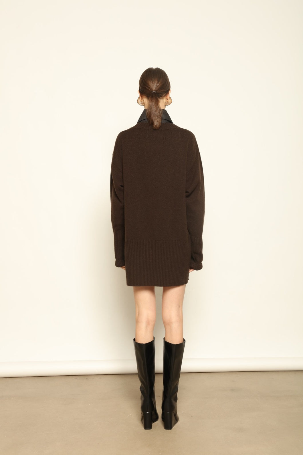 Model wearing the Chocolate Noemi Round Neck Cashmere Pullover by House of Nomad Stories, made from 100% pure Inner Mongolia cashmere, featuring a deep chocolate tone, soft texture, relaxed fit, and sustainable luxury craftsmanship