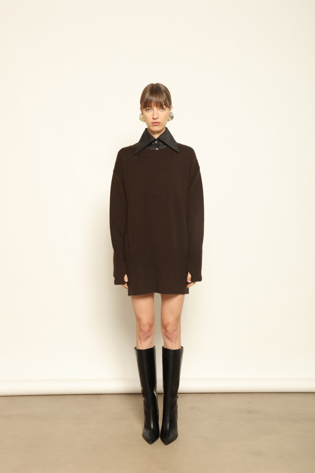 Model wearing the Chocolate Noemi Round Neck Cashmere Pullover by House of Nomad Stories, made from 100% pure Inner Mongolia cashmere, featuring a deep chocolate tone, soft texture, relaxed fit, and sustainable luxury craftsmanship