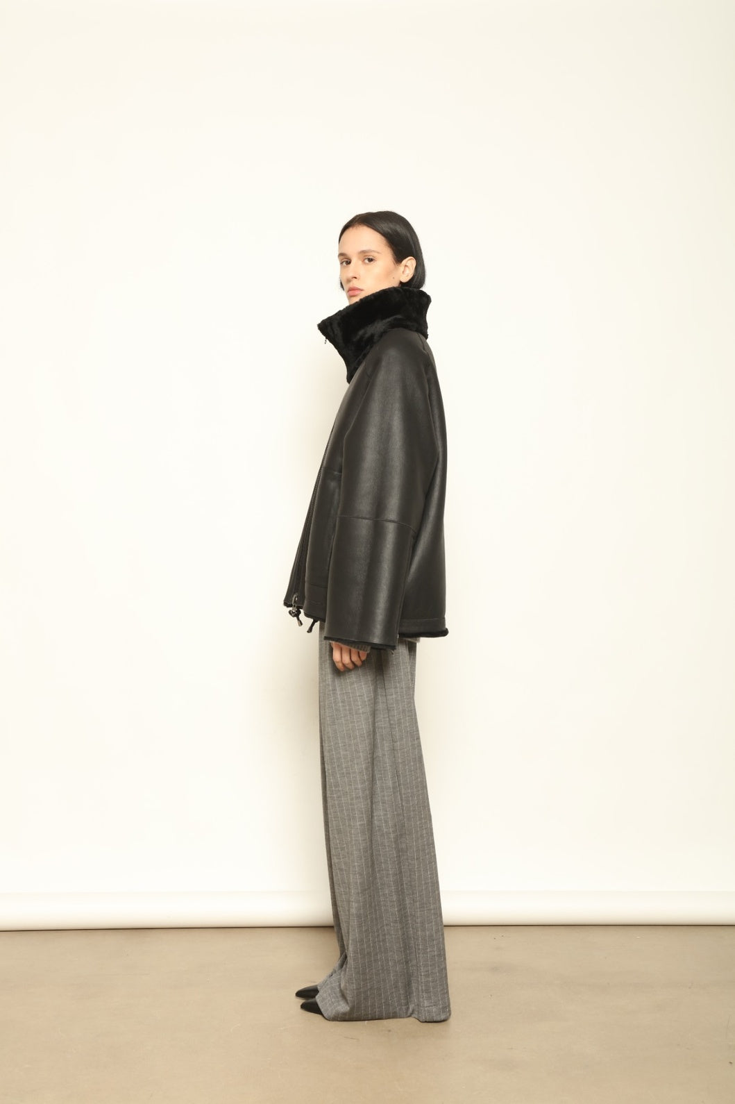 Colette Sud Africa Ironed Black Nappa Jacket by Novelle – reversible Italian shearling and nappa leather jacket in polished black, handcrafted for timeless elegance at House of Woven Stories.