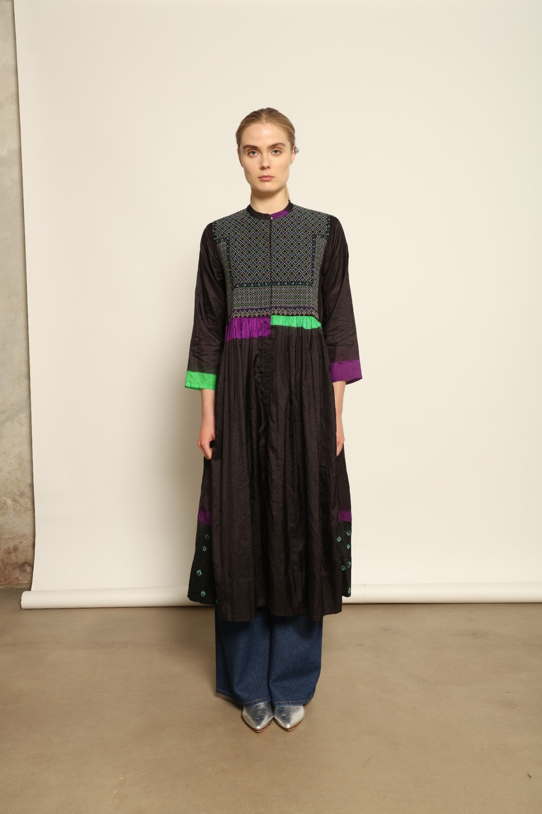 Model is wearing Folklore 10 Handmade Cotton and Silk Dress by Injiri, part of the House of Nomad Stories selection, crafted in India from a cotton and silk blend with round neckline, long sleeves, side pockets, and artisanal detailing.