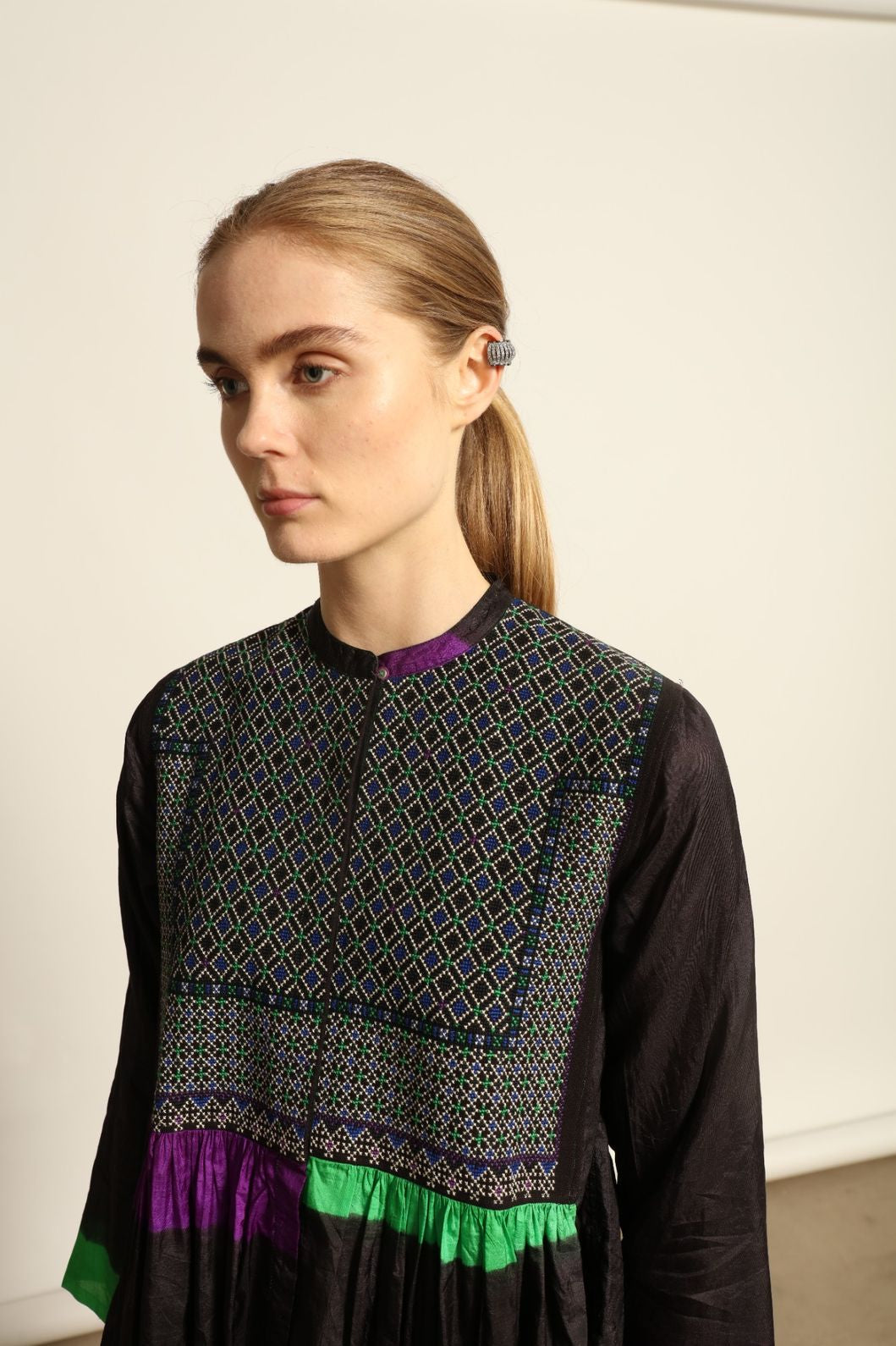 Model is wearing Folklore 10 Handmade Cotton and Silk Dress by Injiri, part of the House of Nomad Stories selection, crafted in India from a cotton and silk blend with round neckline, long sleeves, side pockets, and artisanal detailing.