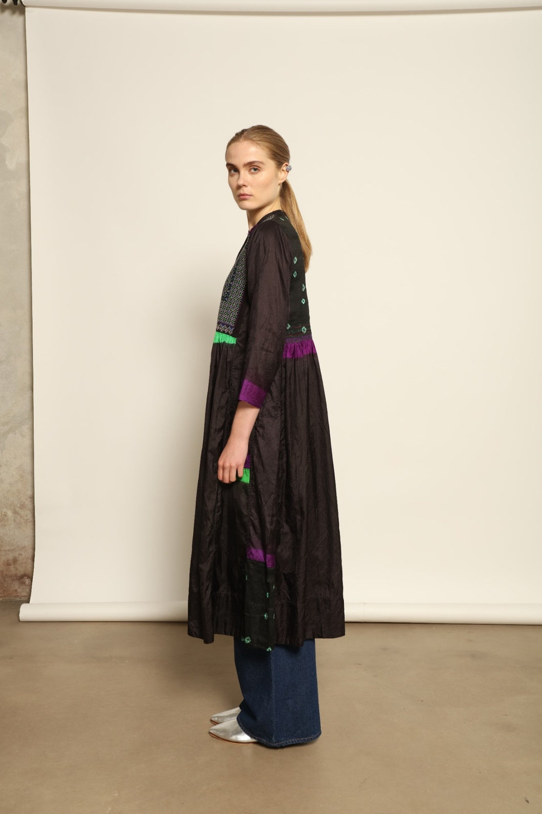 Model is wearing Folklore 10 Handmade Cotton and Silk Dress by Injiri, part of the House of Nomad Stories selection, crafted in India from a cotton and silk blend with round neckline, long sleeves, side pockets, and artisanal detailing.