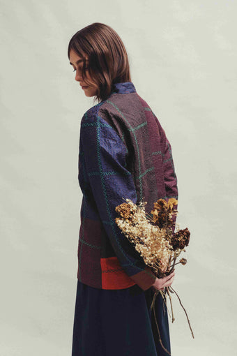 Model is wearing the Folklore 82 silk hand-loomed jacket by Injiri, featuring lightweight silk, refined tailoring, and artisanal craftsmanship, handmade in India. 