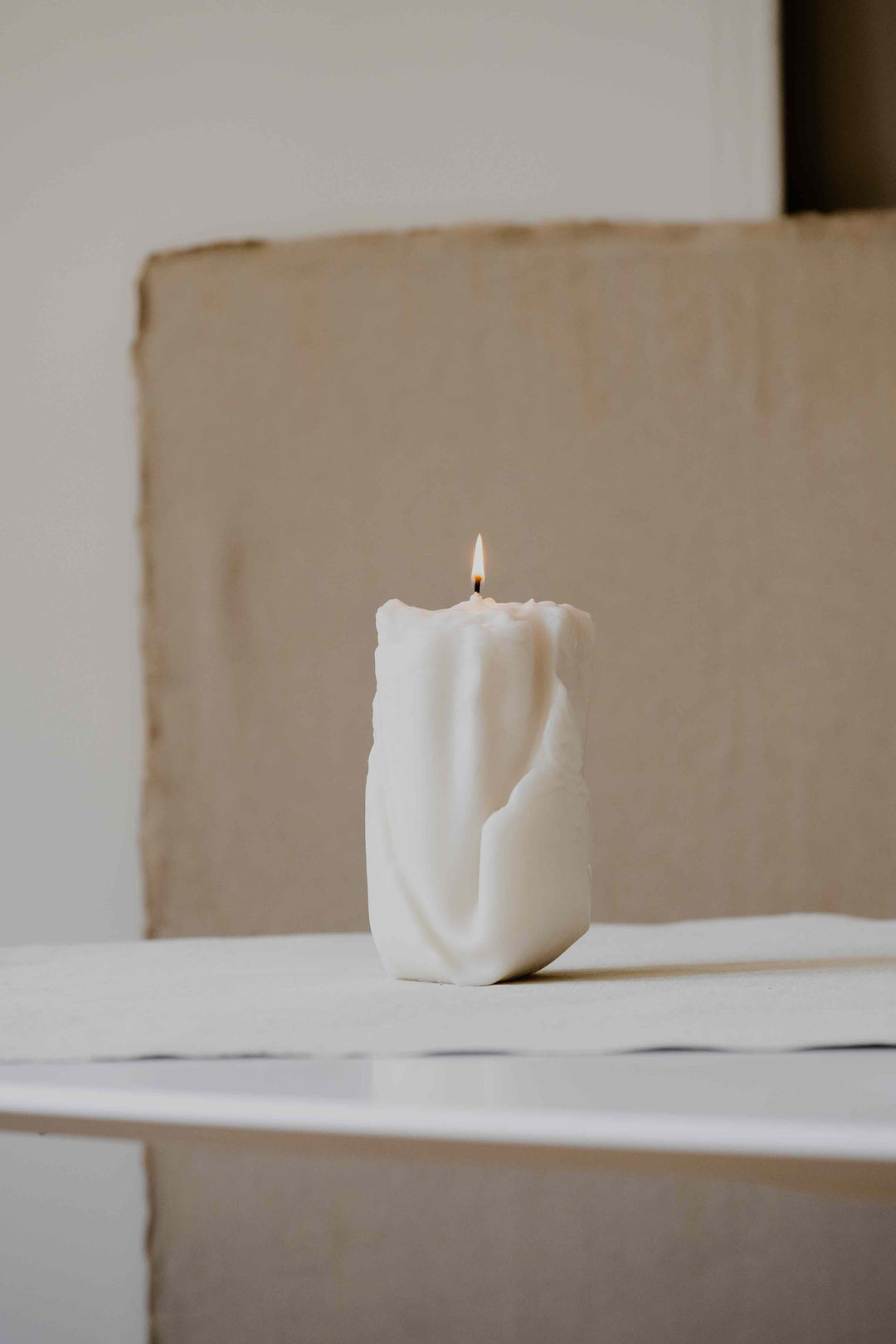 Ghost in Cream by Oberflacht, part of the House of Nomad Stories selection. Handcrafted from beeswax and paraffin with soft matte finish, sculptural form, and unique artisanal variations.