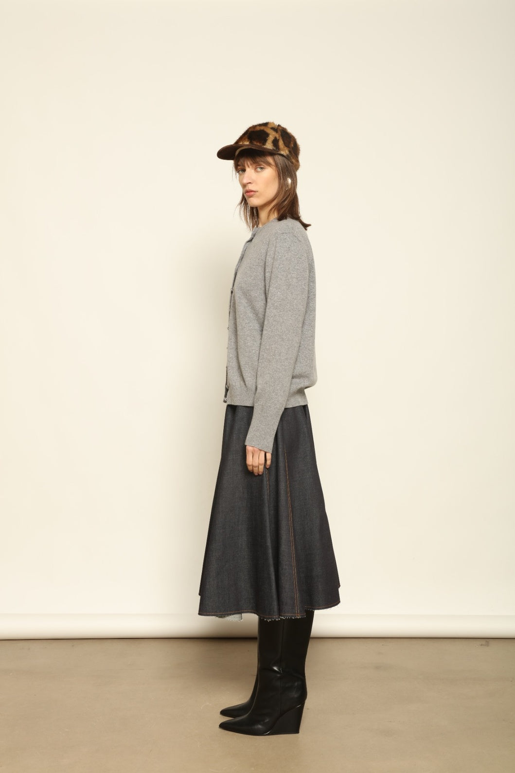 Model wearing the Graphite Nathalie Cashmere Cardigan by House of Nomad Stories, made from 100% pure Inner Mongolia cashmere, featuring a deep graphite grey tone, soft breathable texture, open-front silhouette, and sustainable luxury craftsmanship