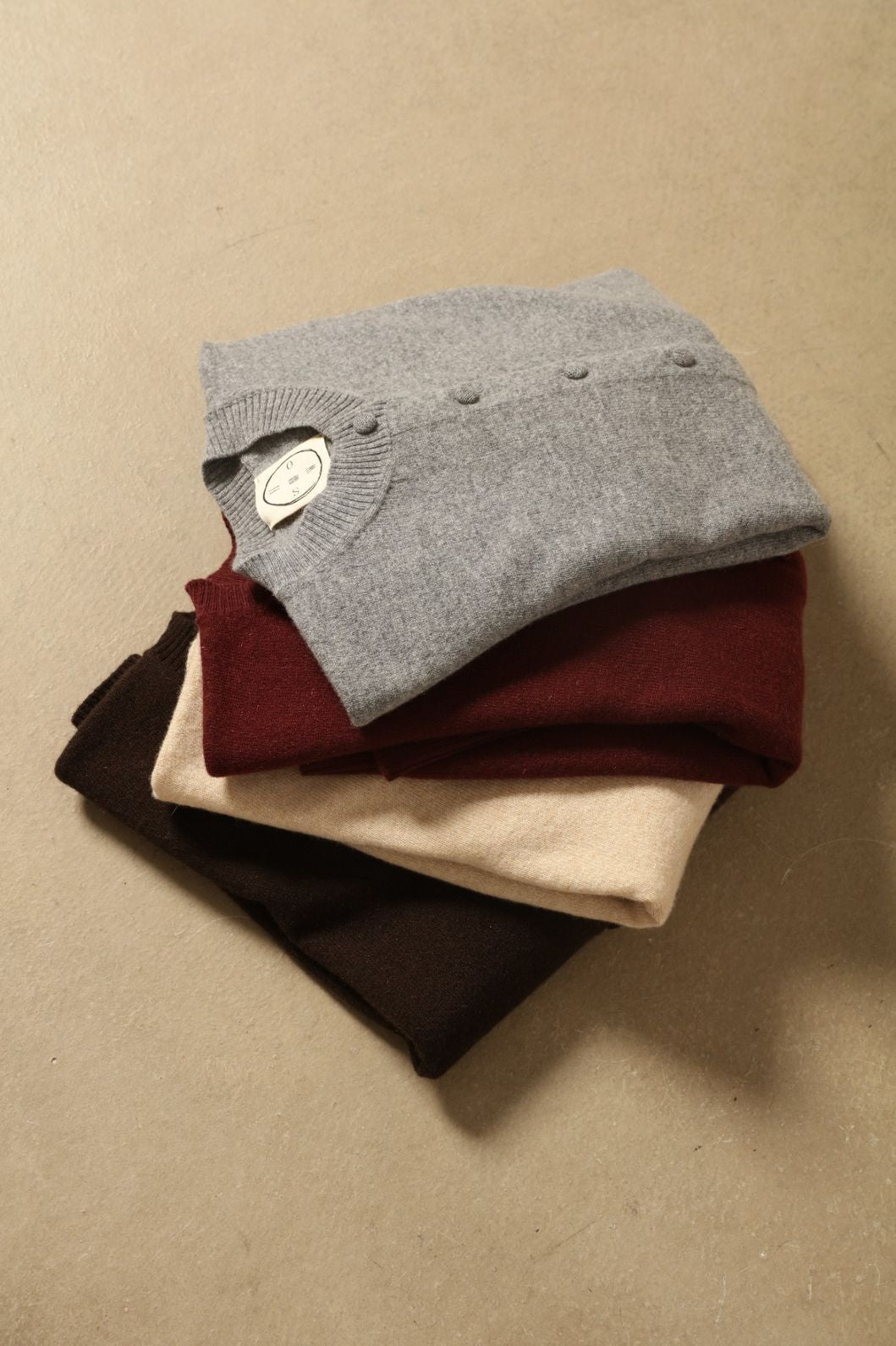 Graphite Nathalie Cashmere Cardigan by House of Nomad Stories, made from 100% pure Inner Mongolia cashmere, featuring a deep graphite grey tone, soft breathable texture, open-front silhouette, and sustainable luxury craftsmanship