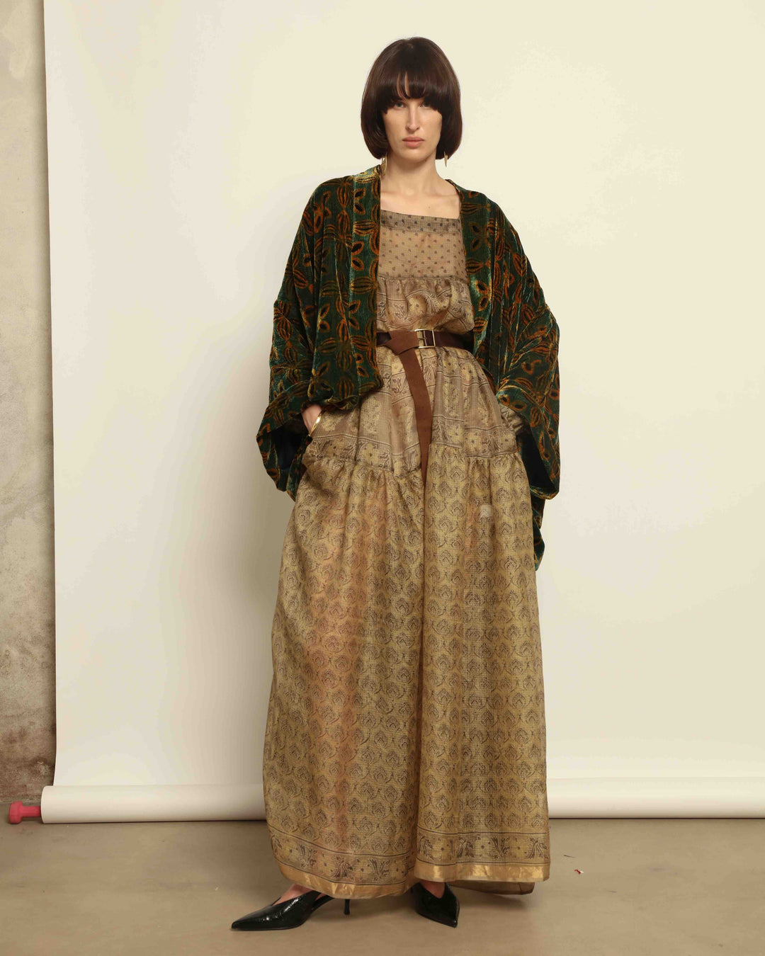 Model is wearing vintage-inspired maxi dress in lightweight 100% silk chiffon with square neckline, voluminous sleeves, and delicate all-over print. Part of House of Nomad Stories selection.