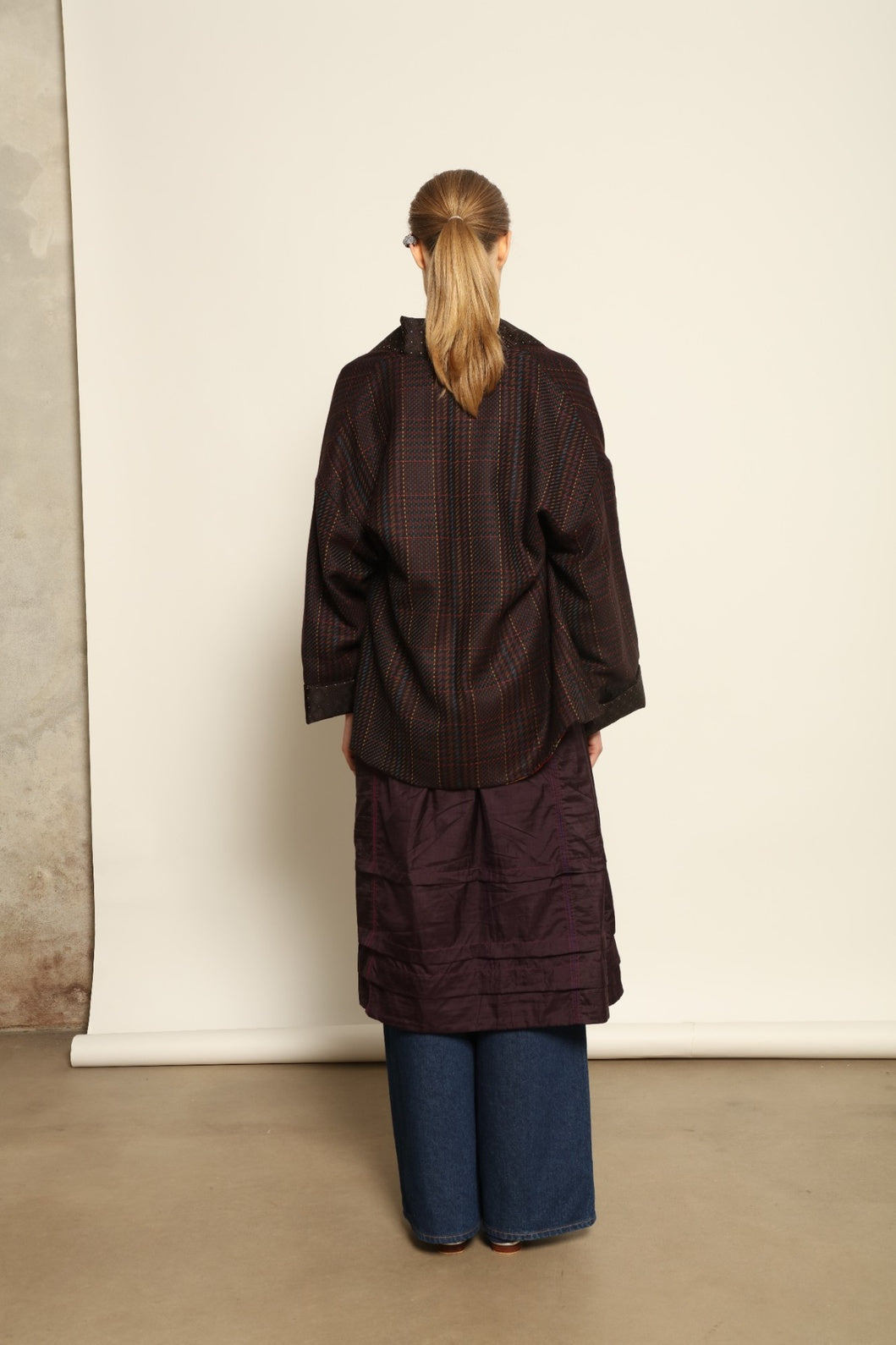 Model is wearing the Harmony Kantha Jacket by Obidi, made from reused sari fabric with traditional kantha hand-stitching, combining heritage craftsmanship with a contemporary silhouette.