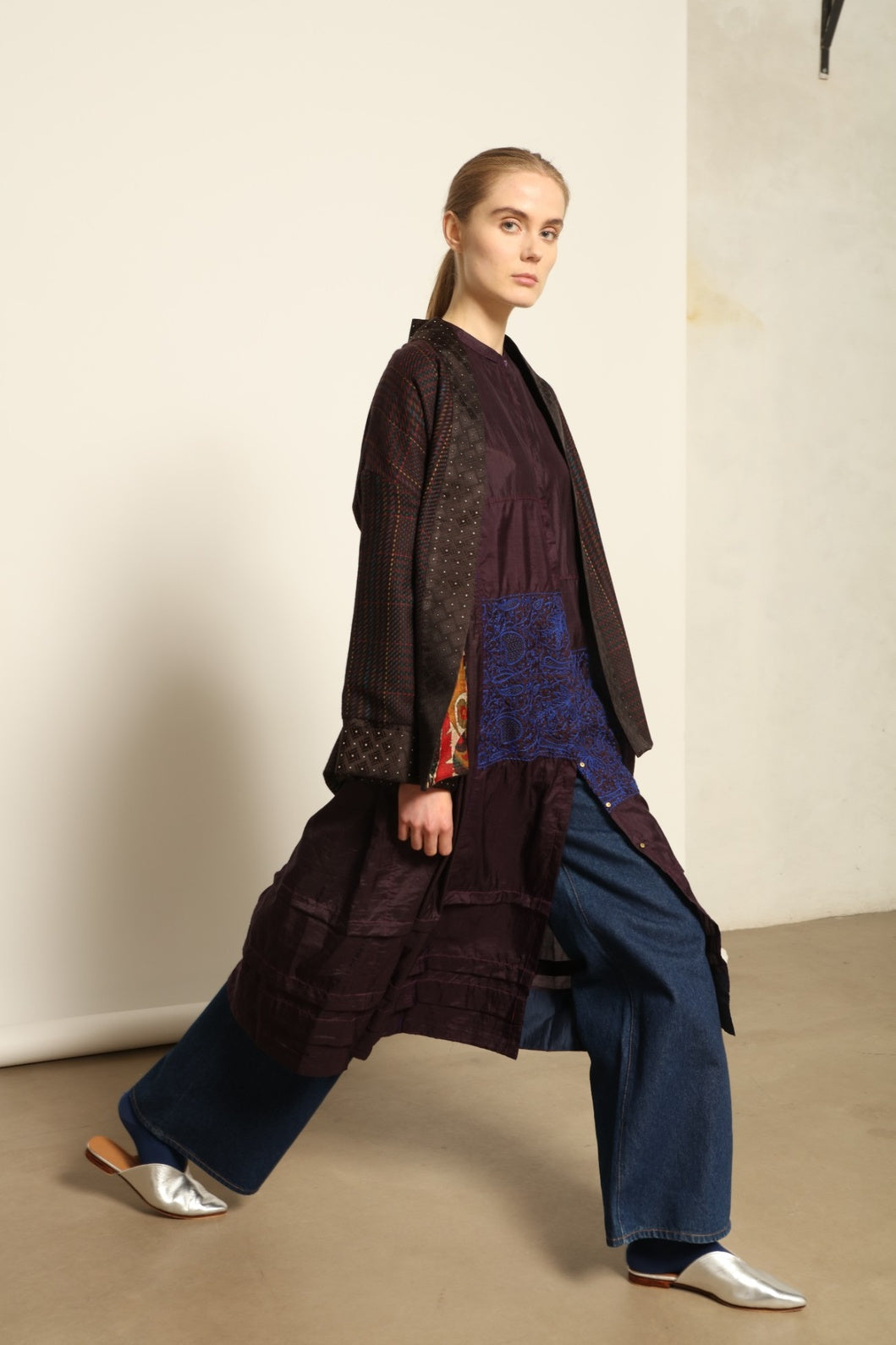 Model is wearing the Harmony Kantha Jacket by Obidi, made from reused sari fabric with traditional kantha hand-stitching, combining heritage craftsmanship with a contemporary silhouette.