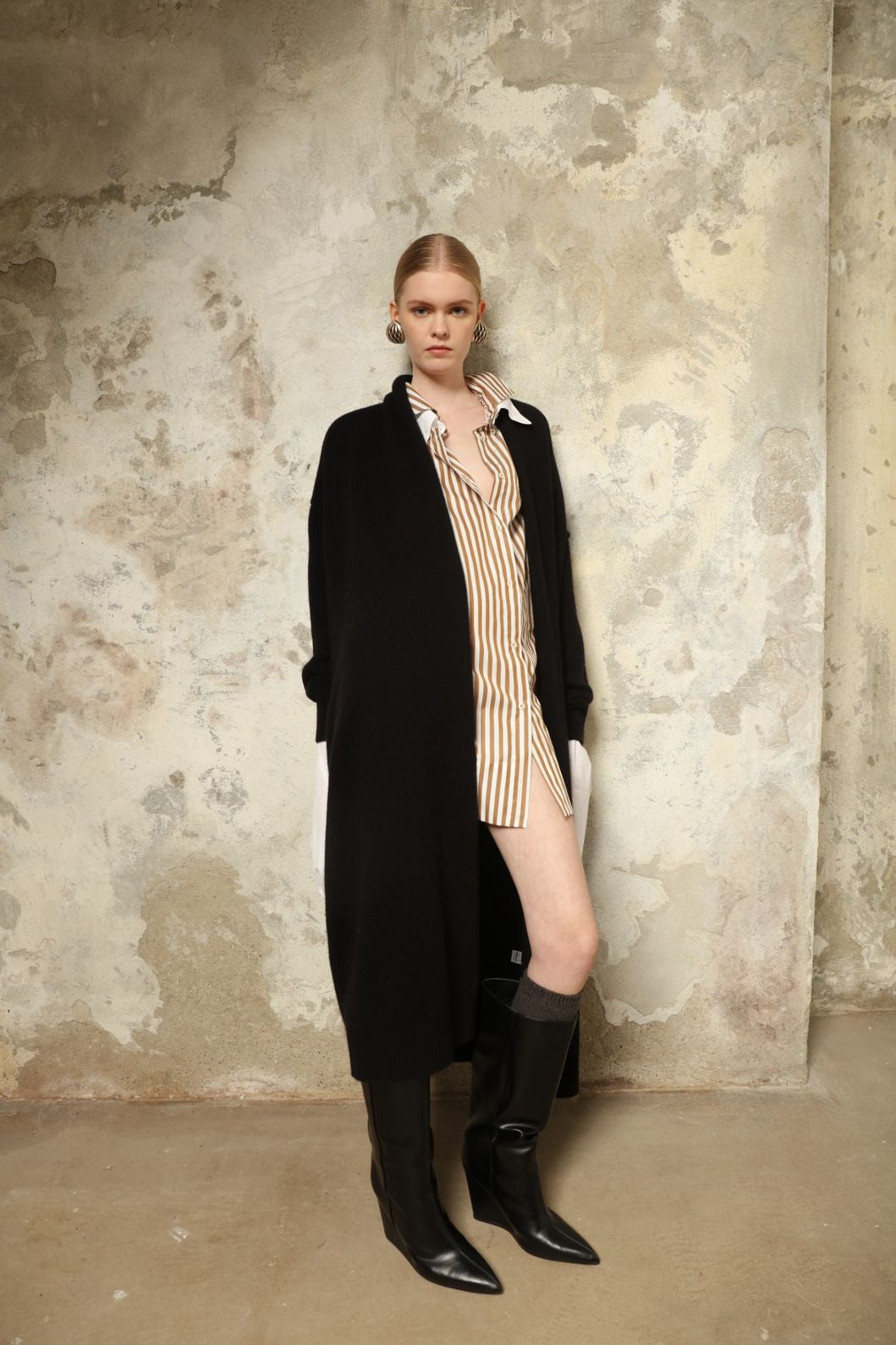 Model is wearing the Black Paula Cashmere Coat by House of Nomad Stories, a pure ethically sourced cashmere coat in deep black with fluid open-front silhouette and refined drape.