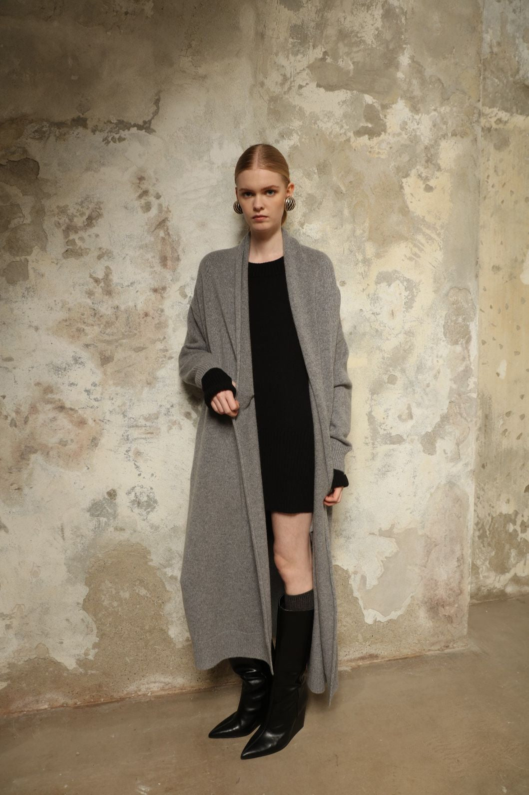 Model is wearing the Graphite Paula Cashmere Coat by House of Nomad Stories, a pure ethically sourced cashmere coat in deep graphite with fluid open-front silhouette and refined soft drape.