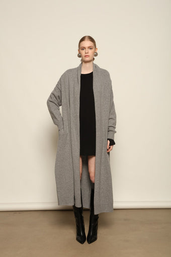 Model is wearing the Graphite Paula Cashmere Coat by House of Nomad Stories, a pure ethically sourced cashmere coat in deep graphite with fluid open-front silhouette and refined soft drape.