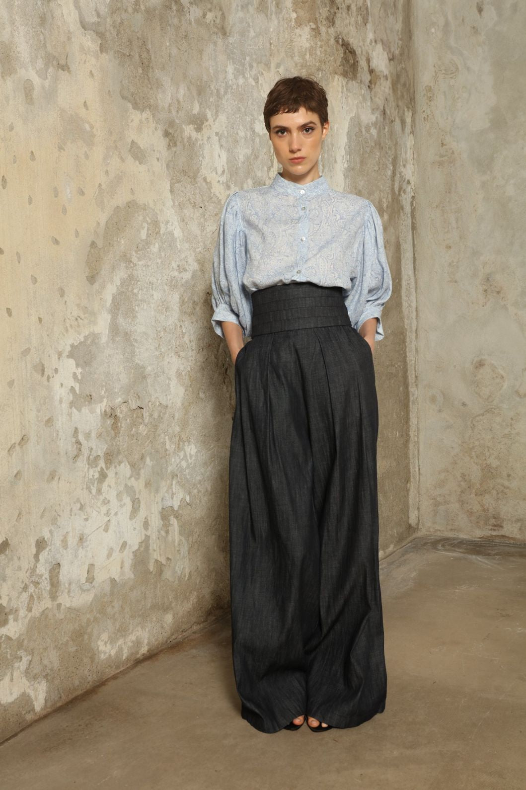 Model wearing the Lola Paisley Blouse by House of Nomad Stories, featuring 100% linen fabric, delicate paisley print, relaxed silhouette, and lightweight breathable summer design.