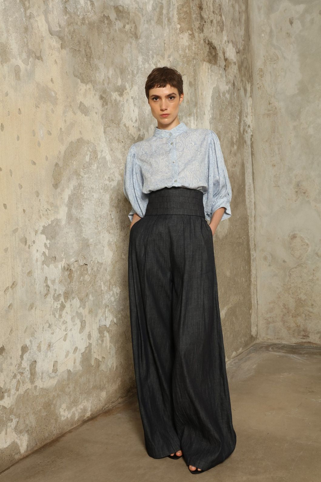 Model wearing the Lola Paisley Blouse by House of Nomad Stories, featuring 100% linen fabric, delicate paisley print, relaxed silhouette, and lightweight breathable summer design.