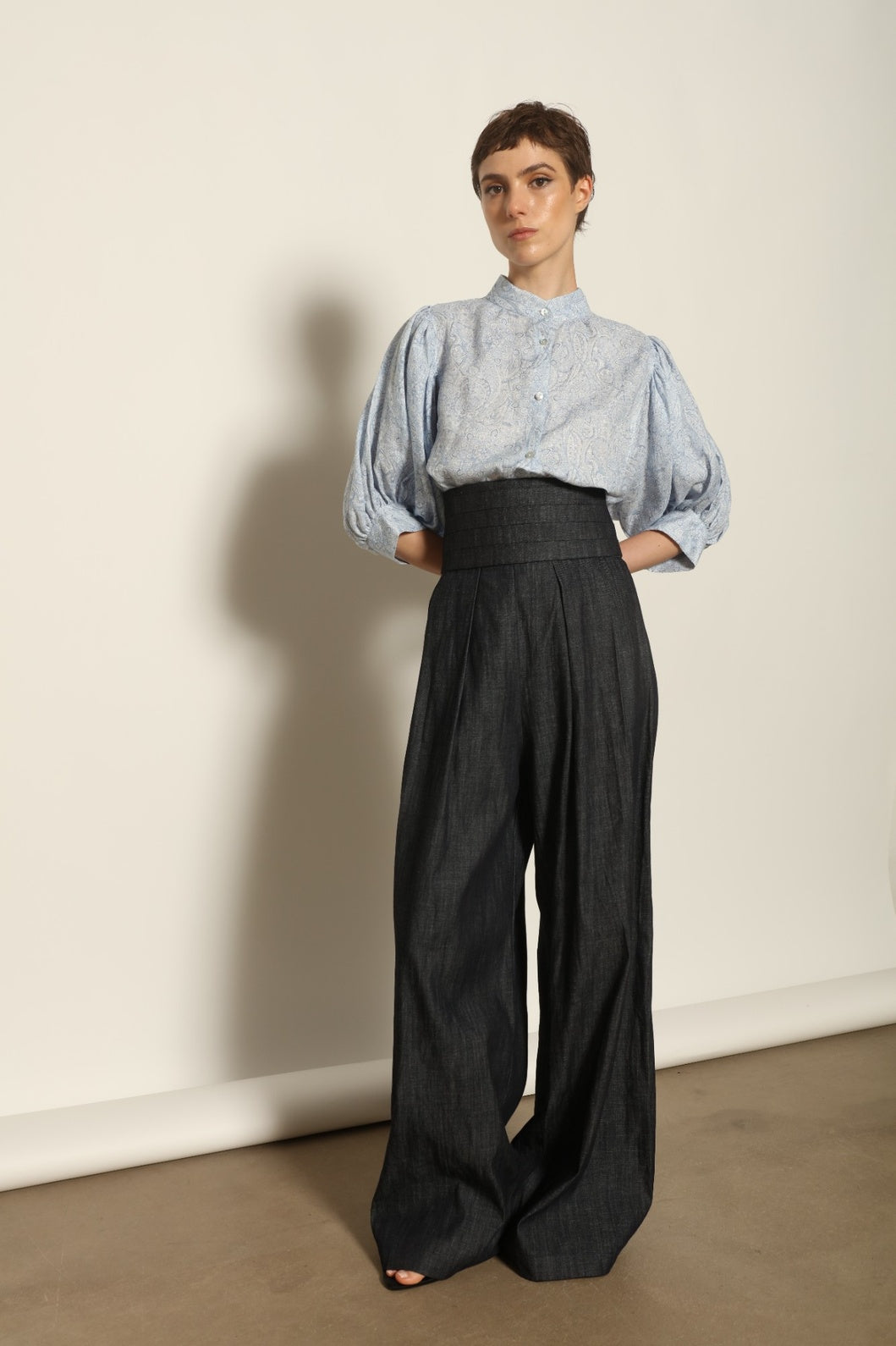Model wearing the Lola Paisley Blouse by House of Nomad Stories, featuring 100% linen fabric, delicate paisley print, relaxed silhouette, and lightweight breathable summer design.