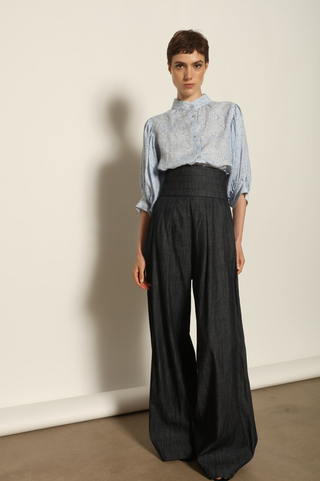 Model wearing the Lola Paisley Blouse by House of Nomad Stories, featuring 100% linen fabric, delicate paisley print, relaxed silhouette, and lightweight breathable summer design.