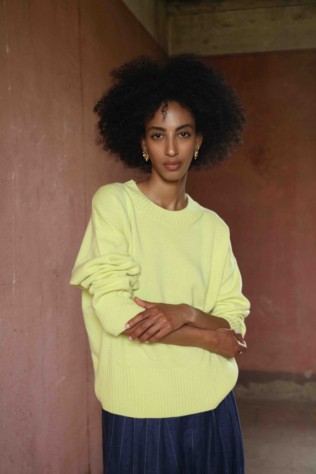 Nena Round Neck Sweater by House of Nomad Stories 100% pure, undyed Inner Mongolian cashmere. Soft, breathable, handcrafted in natural tones. Relaxed fit with ribbed trims. Sustainable luxury knitwear.