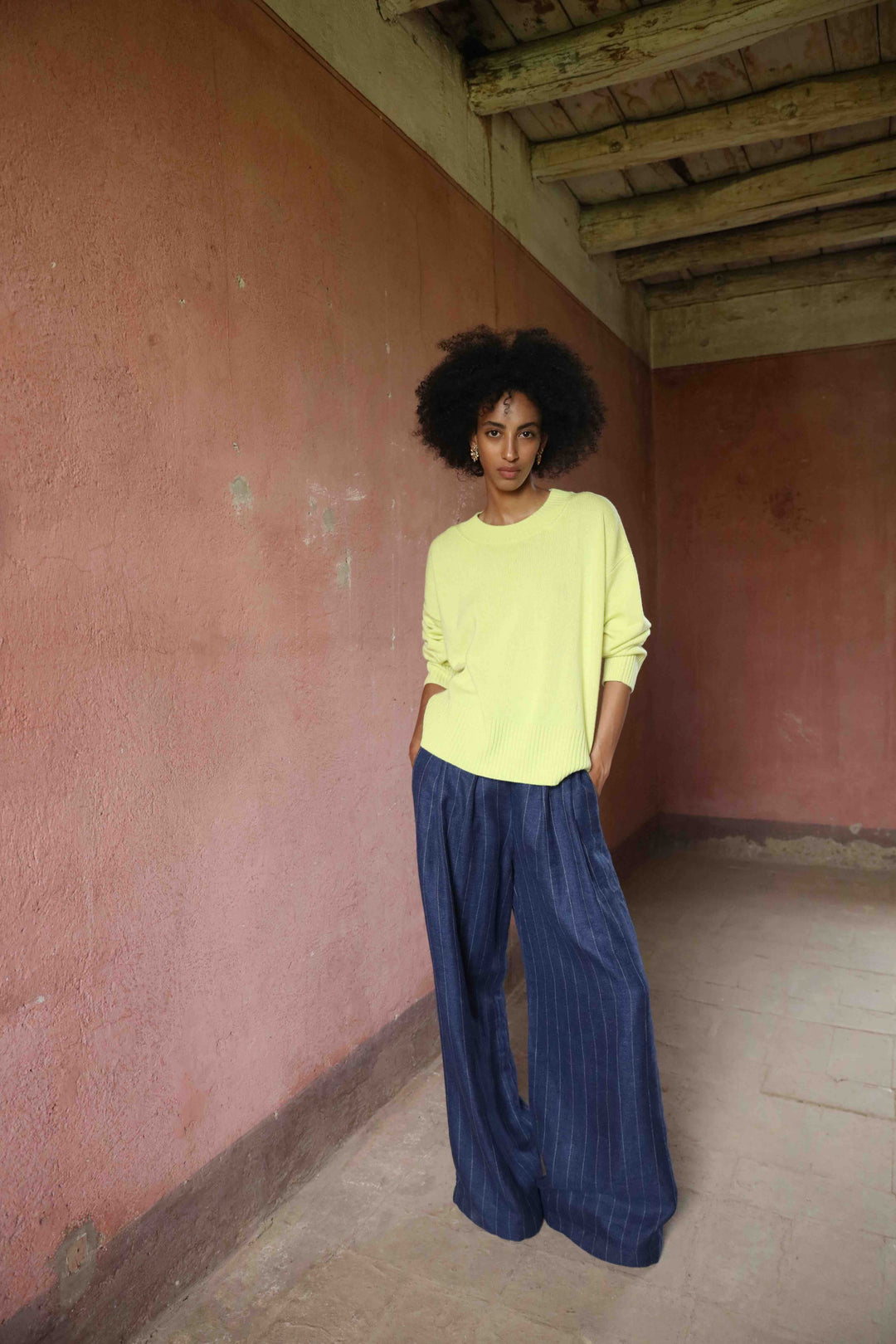 Wide-leg striped trousers in linen, wool, and silk by House of Nomad Stories, featuring a mid-rise elastic waistband, front pleats, and side pockets, handmade in Italy.
