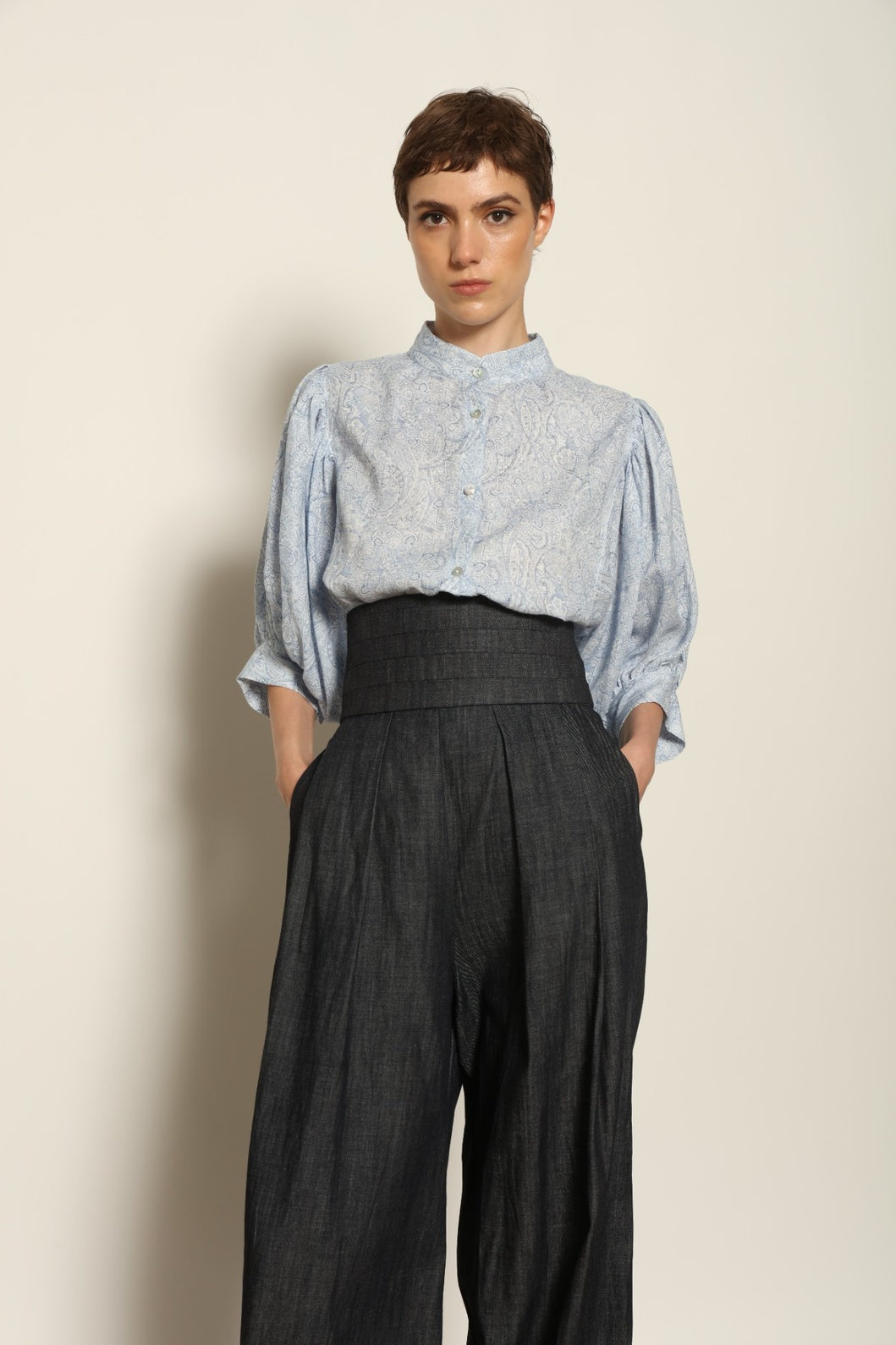 Model wearing the Sergey Night Blue Cummerbund by House of Nomad Stories, featuring a structured silk-wool blend, deep night blue tone, and sculptural waist-defining silhouette.