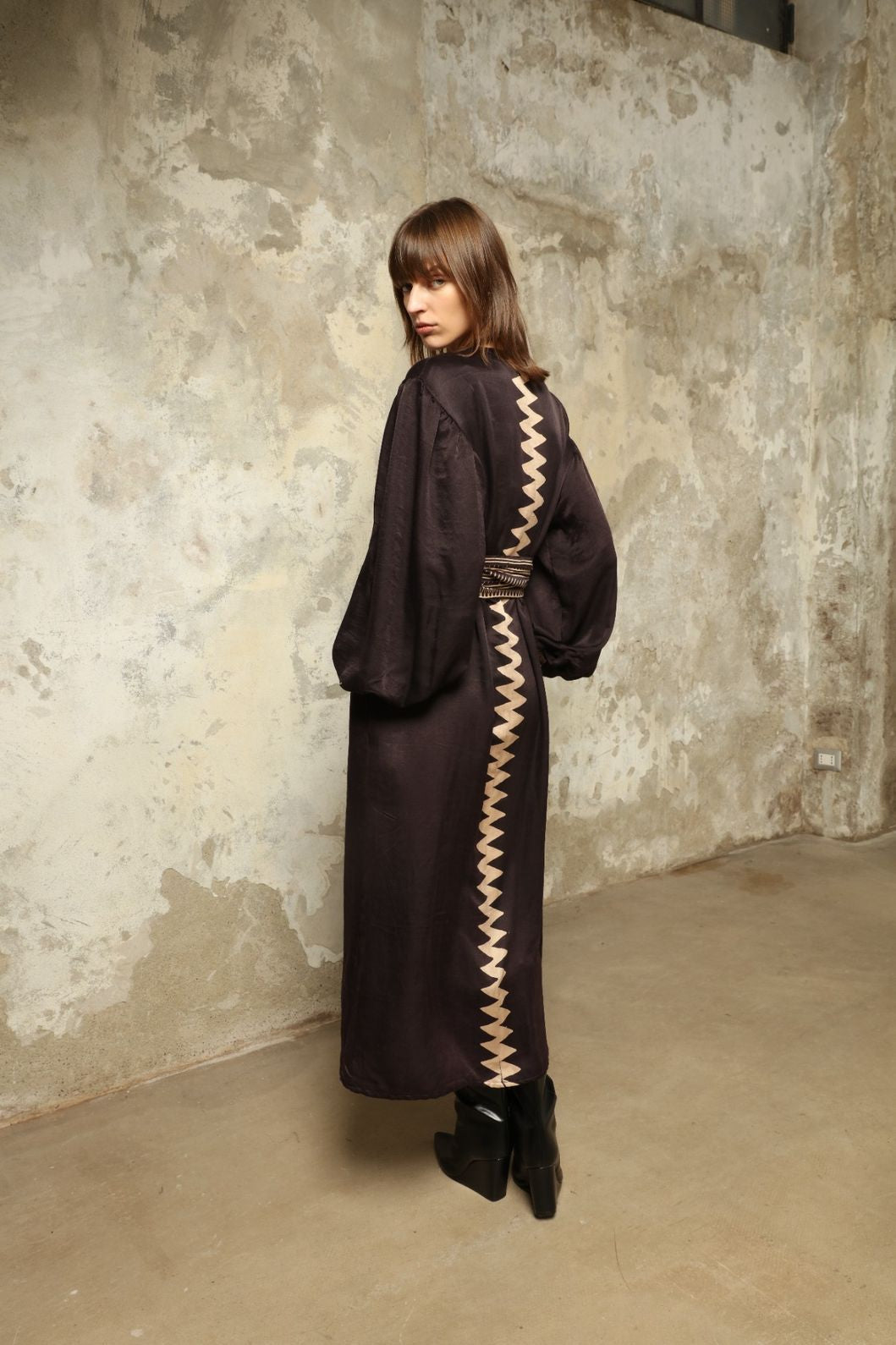 Model is wearing the Ibiza Silk Dress with Belt by House of Nomad Stories, made from Seta Mulberry silk with hand-printed Ajrakh patterns, styled with two silk belts for a versatile silhouette.