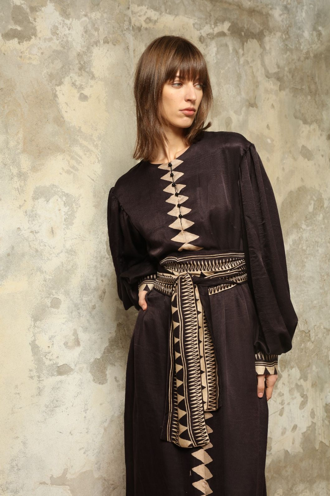 Model is wearing the Ibiza Silk Dress with Belt by House of Nomad Stories, made from Seta Mulberry silk with hand-printed Ajrakh patterns, styled with two silk belts for a versatile silhouette.