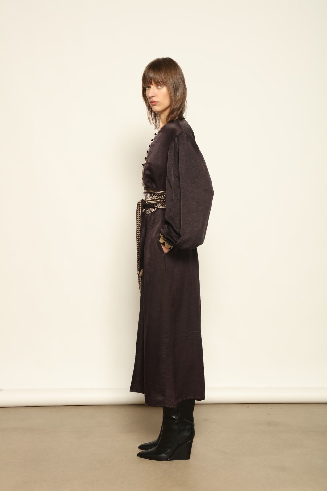 Model is wearing the Ibiza Silk Dress with Belt by House of Nomad Stories, made from Seta Mulberry silk with hand-printed Ajrakh patterns, styled with two silk belts for a versatile silhouette.