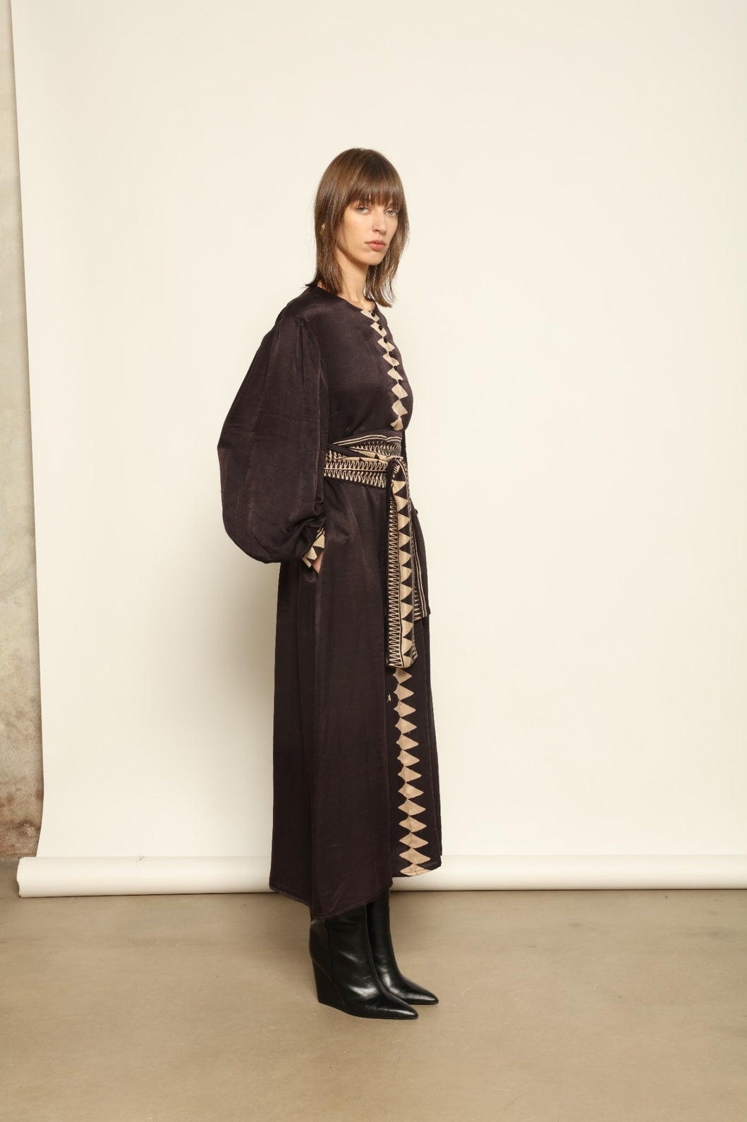 Model is wearing the Ibiza Silk Dress with Belt by House of Nomad Stories, made from Seta Mulberry silk with hand-printed Ajrakh patterns, styled with two silk belts for a versatile silhouette.