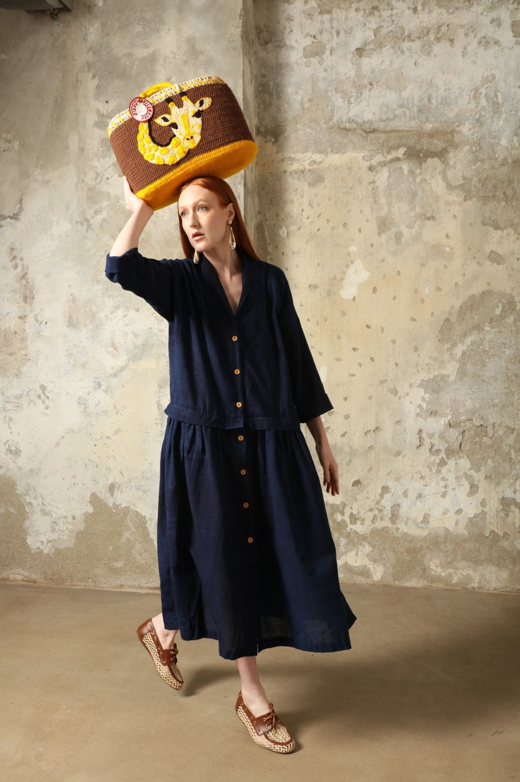 Indigo Marie Dress by House of Nomad Stories, crafted from 100% cotton and hand-dyed with natural indigo in India, featuring a fluid silhouette and unique variations created by the artisanal dyeing process.